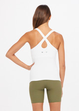 THE UPSIDE Balance Seamless Lenny Tank in White is a mid-coverage scoop neck seamless rib tank with cross back straps and shelf bra with removable cups.