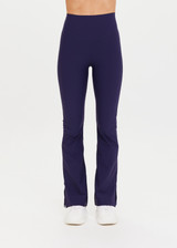 THE UPSIDE Peached Florence Flare in Navy is a sustainable high-rise full length flare pant with “V” waistband detail and printed arrow logo at back waistband.