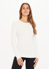 THE UPSIDE white Chrissy Long Sleeve top made from organic cotton is designed for a slim fit and features ribbed fabrication, crew neck and an embroidered tonal arrow logo.