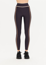THE UPSIDE Northstar 25inch Midi Pant in Black is a sustainable mid-rise 7/8 length legging with waistband and side pockets framed in chestnut and cream panels.