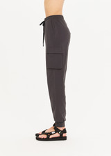 THE UPSIDE Palisade Camino Track in Washed Black is a sustainable organic cotton slim line, light weight track pant with pockets, ribbed cuffs and elasticated drawcord waist.