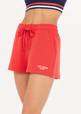 THE UPSIDE Courtsport Zippy Short in Chilli Red is a sustainable classic gym short with side seam and back patch pockets and elastic drawstring at waist.