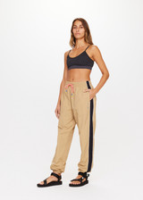 THE UPSIDE Altitude Kendall Pant in Chestnut Brown is a recycled pant with contrast side panels and piping, pockets and elasticated waistband with a two tone paracord.