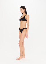 THE UPSIDE Camp Cove Moss Pant in Black is a recycled mid coverage bikini pant in our soft recycled ribbed fabrication.