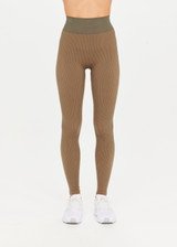 THE UPSIDE Ribbed Seamless 25inch Midi Pant in Khaki is a mid-rise 25” midi length legging in a two tone seamless khaki rib fabrication with reverse ribbed constructed side panels.