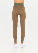 THE UPSIDE Ribbed Seamless 25inch Midi Pant in Khaki is a mid-rise 25” midi length legging in a two tone seamless khaki rib fabrication with reverse ribbed constructed side panels.