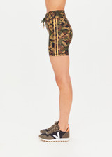 THE UPSIDE Basecamp 5inch Spin Short in our Basecamp Camo print is a recycled mid-rise 5” spin short with contrast orange binds down sides and drawcord at waistband.