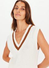 THE UPSIDE Bleeker Quinn Knit Vest in White is a sustainable organic cotton waffle knit cropped vest with a deep “V” neckline, knitted stripe neck detail and soft ribbed neckline, armholes and hem.