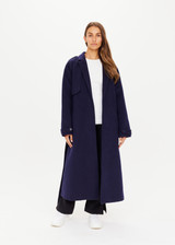 THE UPSIDE Voss Coat in Navy is a heavyweight felted coat with pockets, storm flap and peak lapels, raglan sleeves with belted cuffs and buttons, and removable belt.