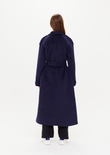 THE UPSIDE Voss Coat in Navy is a heavyweight felted coat with pockets, storm flap and peak lapels, raglan sleeves with belted cuffs and buttons, and removable belt.