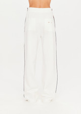THE UPSIDE Bleeker Monte Pant in White is a sustainable high-waisted straight leg pant with contrast stripe tape down sides, pockets and elastic at waist.