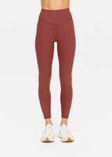 THE UPSIDE womens red-brown Ribbed 25In Midi Pant made with Ultra Soft Recycled Rib fabric features a v-shaped high rise waistband, designed for everyday support and wear.