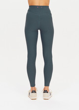 THE UPSIDE womens cool dark blue Ribbed 25In Midi Pant made with Ultra Soft Recycled Rib fabric features a v-shaped high rise waistband, designed for everyday support/wear.
