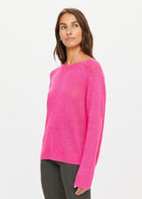 THE UPSIDE womens neon pink Sirena Knit Sweater made with 100% linen features long raglan sleeves and ribbed neck, cuffs and hems; a lifestyle piece.