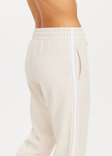 THE UPSIDE womens white straight leg Rodeo Franca Pant made with a soft organic cotton blend features elastic waistband, pockets and white stripes down sides, designed for golf.