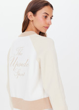 THE UPSIDE womens white/beige/neutral Rodeo Hallie Knit Bomber features welt pockets, contrast sleeves and knitted rib at hem, neck and cuffs.