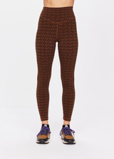 THE UPSIDE women's tobacco brown Obsidian 25 Inch High Midi Pant made with Recycled Jacquard rib fabrication in ‘T’ monogram print design features a high waisted v-front, 25 inch leg length, arrow logo at centre back and moisture wicking properties.