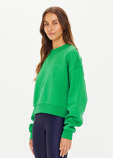 THE UPSIDE women's bright green Drifter Dominique Crew made in organic cotton fleece features a cropped cut, tonal embroidered Horseshoe logo at front chest and a high neck band in soft rib.