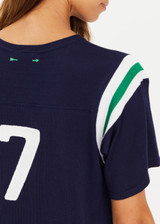 THE UPSIDE women's navy Drifter Seven Tee made in cotton viscose blend knit is a retro-style slim fit tee, featuring a contrasting green and white stripe rib at shoulder, an embroidered “7” on back and ribbed neckline.