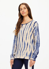 THE UPSIDE women's navy and creme tie dye Wishbone Amana Long Sleeve is made with organic cotton, designed for a relaxed fit. This knitted lifestyle top features a stripy rib neckline.