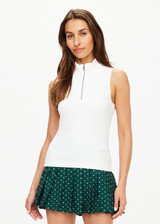 THE UPSIDE women's white Player Top is made with recycled ribbed fabric, designed for a slim fit. This sleeveless top features a quarter zip. Designed for tennis.