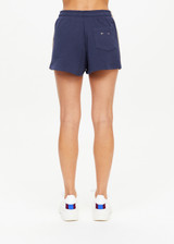 THE UPSIDE women's navy Cascade Zippy Short is made with organic french terry cotton, designed for a relaxed fit. This classic gym short features an elastic drawcord waist.