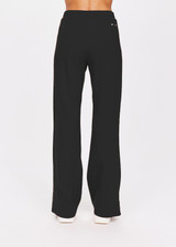 THE UPSIDE women's black Petra Flare is made from a lenzing viscose soft suiting fabrication. The full length tailored pant features side pockets and an elasticated waistband. Designed for walking and recovery.