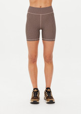 THE UPSIDE women's check Bohemia 5 inch Spin Short is made with recycled soft peached with a brushed handfeel, and moisture wicking, breathable and quick drying properties. This mid rise bike short is designed for yoga, pilates and barre.