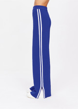 THE UPSIDE women's blue Carnaby Freya Knit Pant is a knitted straight leg pant, featuring a white side stripe and elasticated waistband for comfort. Designed for walking and light movement.