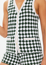 THE UPSIDE women's Portobello Watson Crochet Vest is hand crocheted in a two tone design of green and white. The waistcoat vest features a framed white stripe at the placket, armholes and welt pockets and accessories with white pearlised buttons. Designed for activity golf.