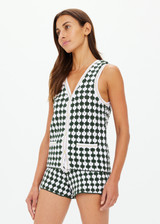 THE UPSIDE women's Portobello Watson Crochet Vest is hand crocheted in a two tone design of green and white. The waistcoat vest features a framed white stripe at the placket, armholes and welt pockets and accessories with white pearlised buttons. Designed for activity golf.