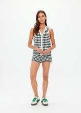 THE UPSIDE women's Portobello Watson Crochet Vest is hand crocheted in a two tone design of green and white. The waistcoat vest features a framed white stripe at the placket, armholes and welt pockets and accessories with white pearlised buttons. Designed for activity golf.