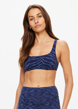 THE UPSIDE women's blue Mystere Reversible Rory Bra is made from recycled fabric. The sports bra features a reversible design. Designed for yoga, pilates and barre.