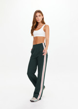 THE UPSIDE women's dark green Monte wide leg, high waisted trackpant features an elastic waistband, side stripes, and front and back pockets.