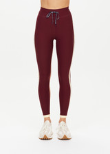 THE UPSIDE women's maroon Trail 25 inch Legging is made from soft, breathable fabric and features a mid-rise waistband with an elasticated drawcord.