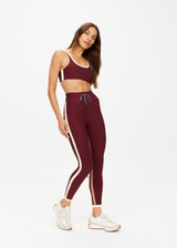 THE UPSIDE women's maroon Trail 25 inch Legging is made from soft, breathable fabric and features a mid-rise waistband with an elasticated drawcord.