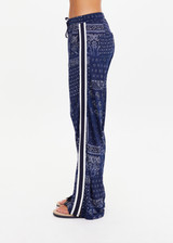 THE UPSIDE women's navy blue paisley Vaquero Roma Pant is made from viscose and rayon. The highwaisted track pants features side stripe detailing. Designed for lifestyle wear.