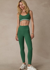 THE UPSIDE women's green Il Pelicano 25 inch Midi Pant is made from recycled rib. The high rise legging features soft folded waistband. Designed for yoga and exercise.