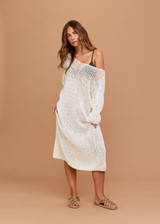 THE UPSIDE women's cream Dusty-Ray Crochet Dress is made from organic cotton. The maxi dress features boat neck and 3/4 sleeve. Designed for lounging and layering.
