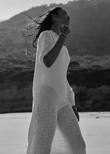 THE UPSIDE women's cream Dusty-Ray Crochet Dress is made from organic cotton. The maxi dress features boat neck and 3/4 sleeve. Designed for lounging and layering.