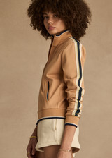 THE UPSIDE women's yellow Le Sport Margot Zip Jacket is designed for a slim fit and features pockets and textured knit side tapes. Perfect for travel and everyday.