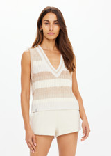THE UPSIDE women's creme organic cotton Nikko V Neck Knit Vest is designed for an oversized fit and features a deep V neckline. Made for everyday.