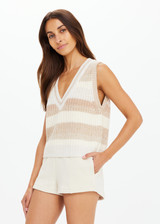 THE UPSIDE women's creme organic cotton Nikko V Neck Knit Vest is designed for an oversized fit and features a deep V neckline. Made for everyday.