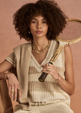 THE UPSIDE women's creme organic cotton Nikko V Neck Knit Vest is designed for an oversized fit and features a deep V neckline. Made for everyday.