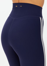 THE UPSIDE women's navy recycled peached Daytona 25 inch Legging is designed for a high-rise supportive fit and features contrast cream binds. Perfect for yoga.
