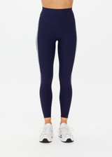 THE UPSIDE women's navy recycled peached Daytona 25 inch Legging is designed for a high-rise supportive fit and features contrast cream binds. Perfect for yoga.