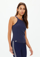 THE UPSIDE women's navy organic cotton Asher Racerback Tank Top is designed for a slim fit and features a racerback shape and high neckline. Ideal for layering & pilates.