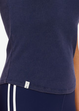 THE UPSIDE women's navy organic cotton Asher Racerback Tank Top is designed for a slim fit and features a racerback shape and high neckline. Ideal for layering & pilates.