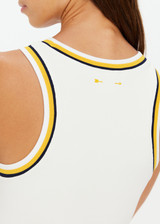 THE UPSIDE women's cream Kristy Rib Tank Top is made in recycled moisture wicking ribbed fabrication with striped rib neckband and armhole. Made for tennis.