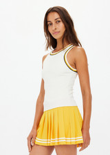 THE UPSIDE women's cream Kristy Rib Tank Top is made in recycled moisture wicking ribbed fabrication with striped rib neckband and armhole. Made for tennis.